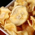 A bowl of crunchy dried parsnip chips.