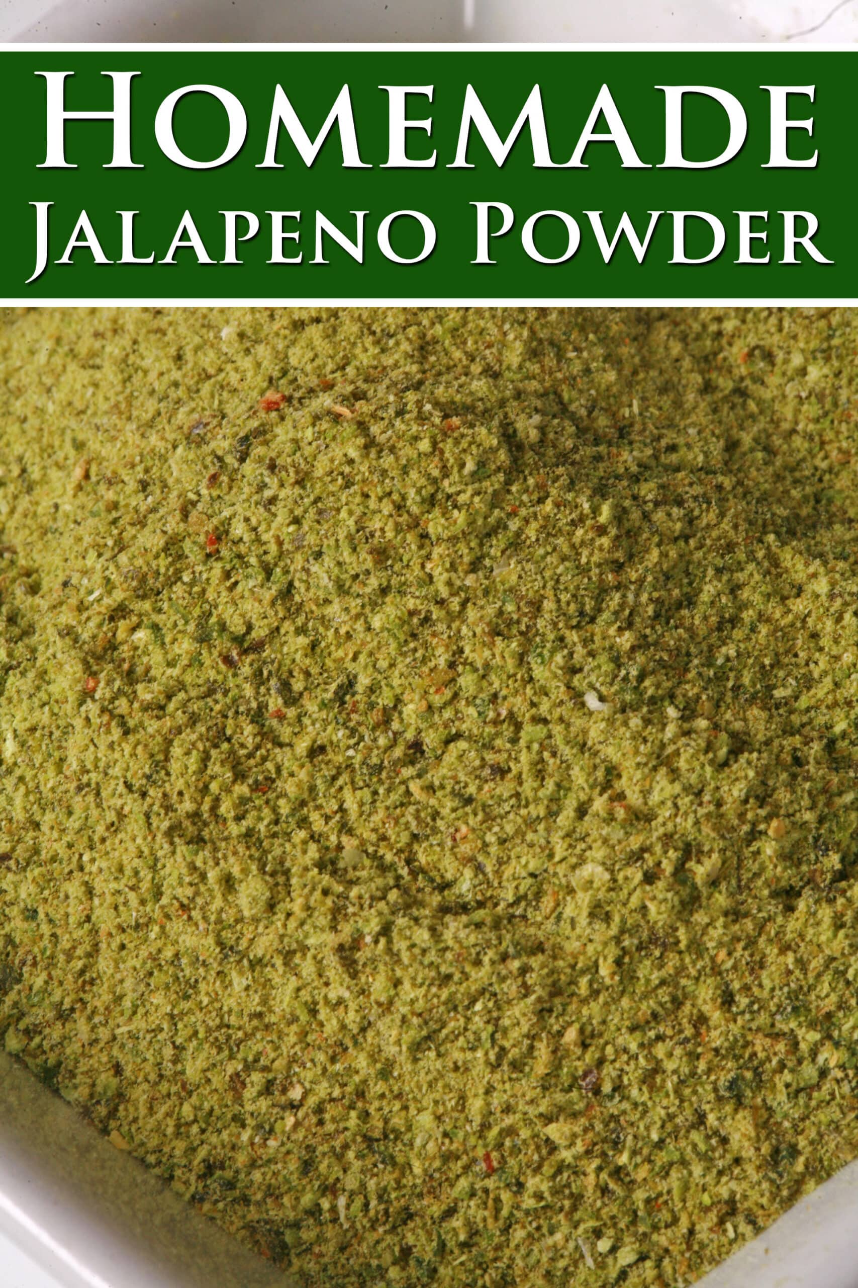 A small bowl of powdered jalapeno peppers. Overlaid text says homemade jalapeno powder.