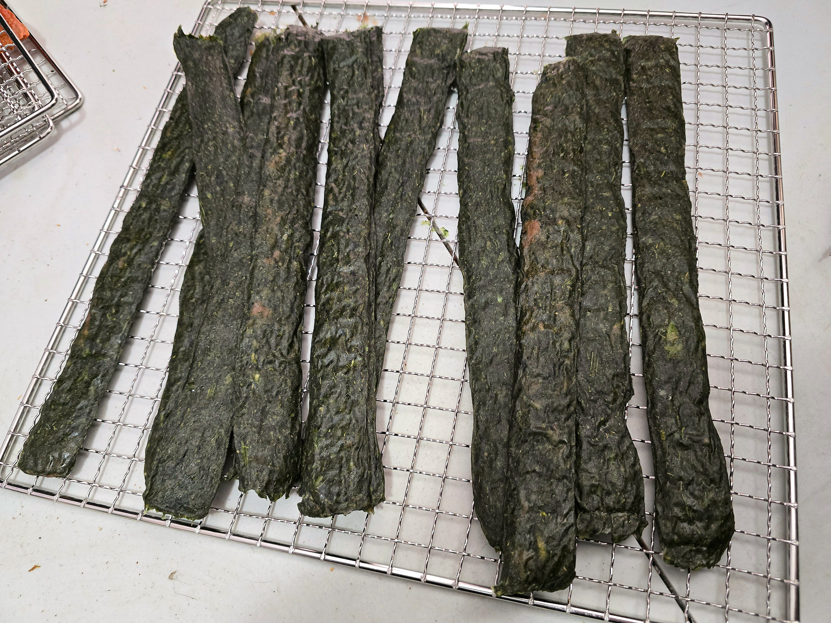 A tray of spanakopita chicken jerky.
